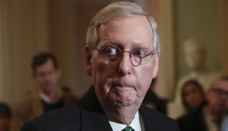 Mitch McConnell escorted away from cameras after freezing during a news conference