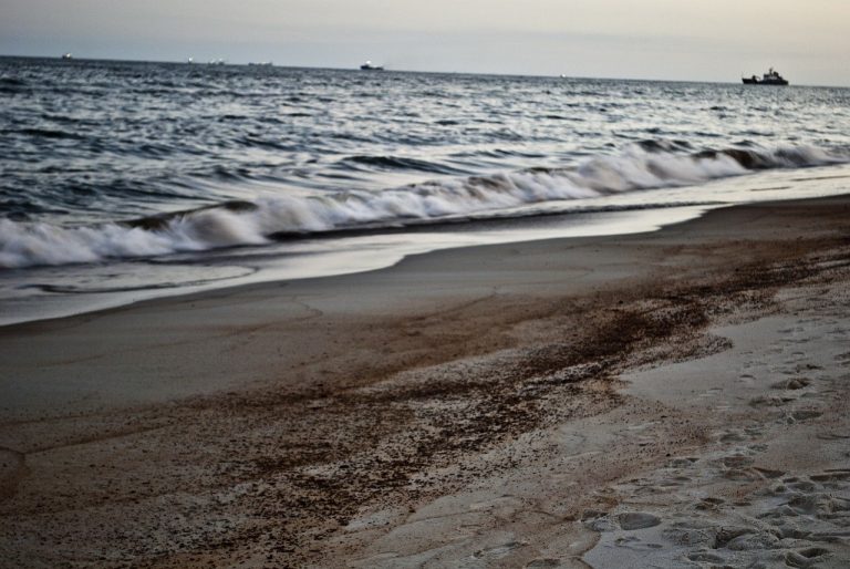 Beach waves oil spill