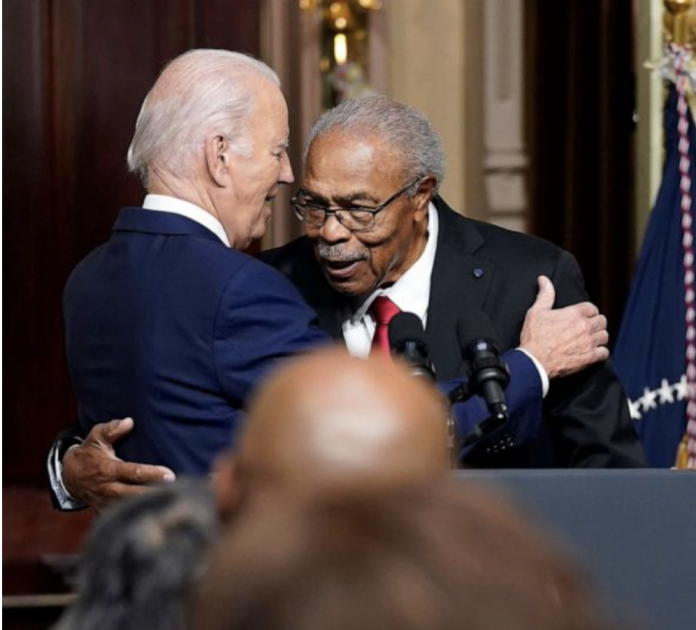 Screenshot 2023-07-26 at 1.48.50 AM Biden and Reverend At Emmett Till Signing